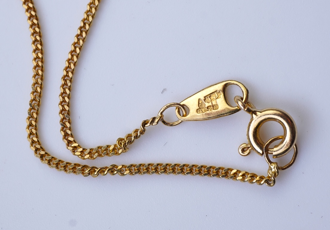 A ruby and diamond pendant